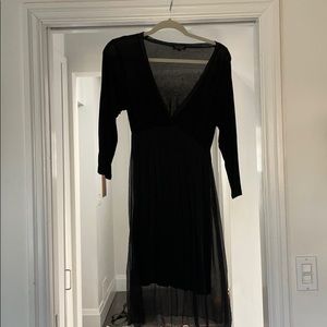 Elegant black sheer-like dress.